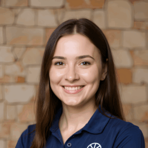 Headshot image of female Masterclass worker stood in front of brick wall.