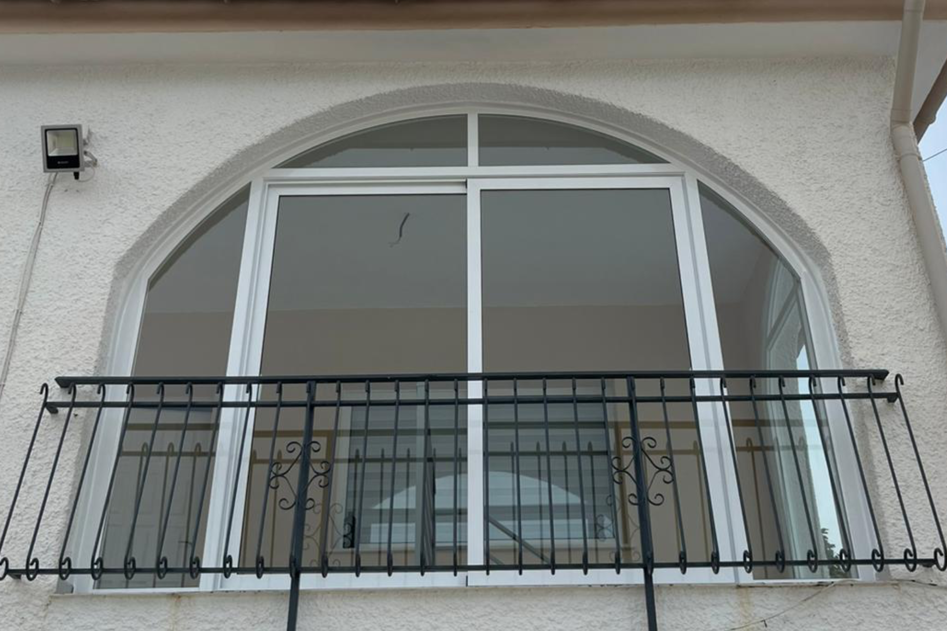 Photo taken looking up at top curved window fitted.